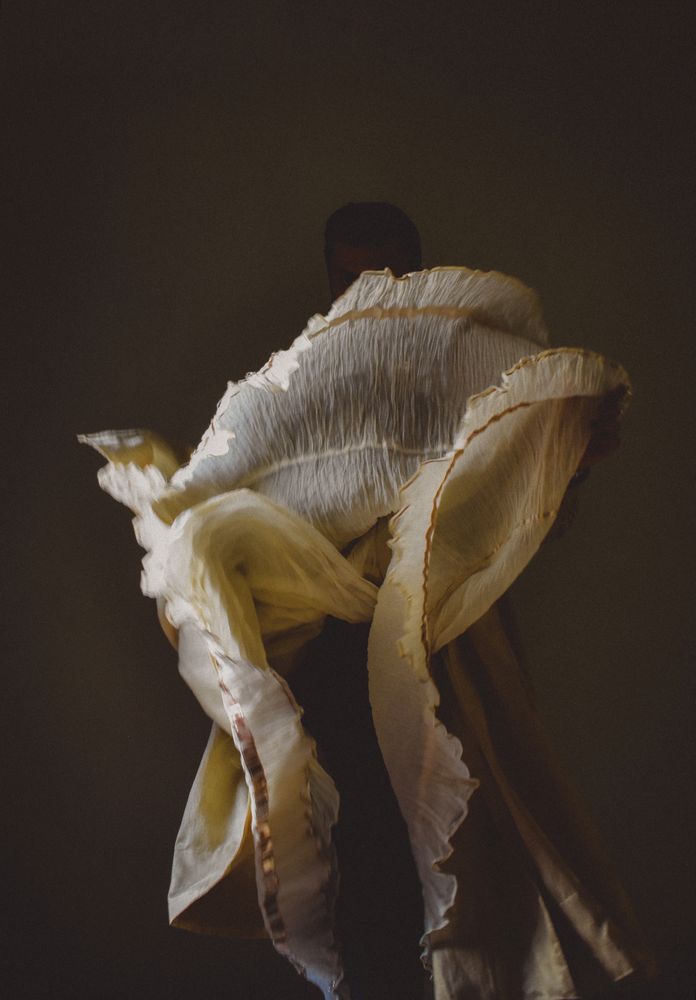 Back view of a man wearing textile