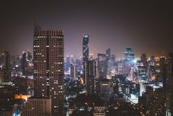Glowing highrise buildings of metropolis