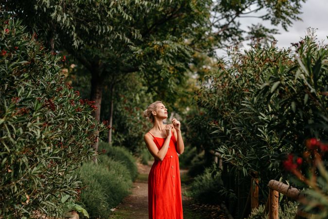 Dreamy young woman in summer garden