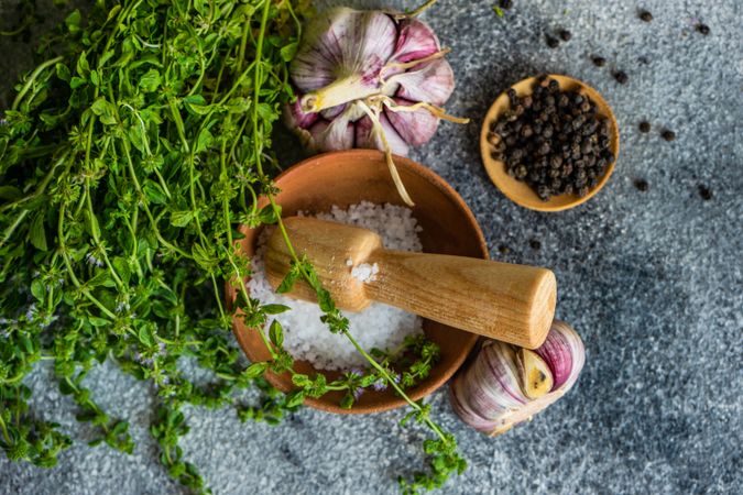 Top view of fresh herbs and seasoning on counter