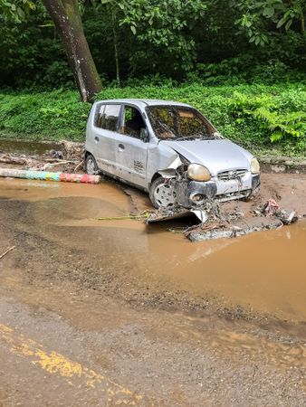 Tanah Datar, Indonesia - May 12, 2024: the condition of the car was badly damaged due to cold lava flash floods. Natural Disaster in Singgalang, Sepuluh Koto District, Tanah Datar, West Sumatra, Indonesia