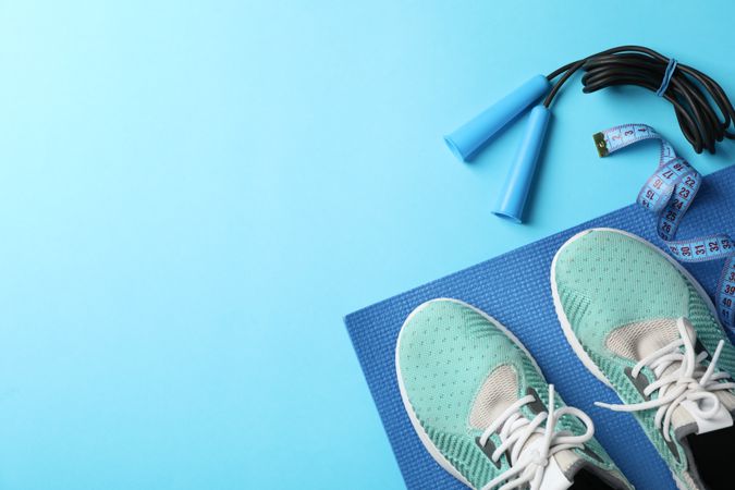Weight loss or healthy lifestyle accessories on blue background