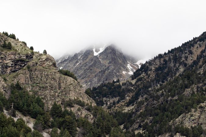 Rocky mountains covered with snow on sunny day