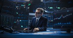 Adult Man in Glasses Looking at Computer Screens, Analyzing Stock Exchange Market Data, Brainstorming a Successful Buying Strategy