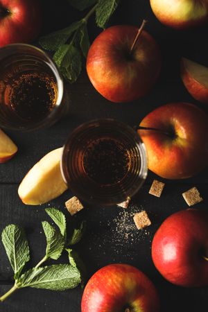 Composition with cider, sugar and apples on wooden background