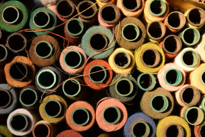 Colored spools of string for sewing machine