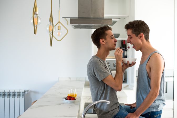 Gay couple having breakfast at home