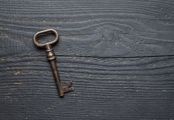 Vintage Key over dark wooden table