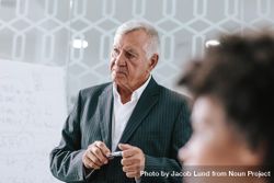 Mature businessman in conference room during a meeting 4dEelb