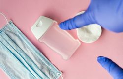 Looking down at pink table with medical supplies