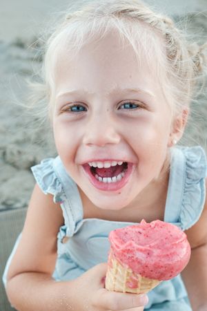 Carefree girl with ice cream in nature
