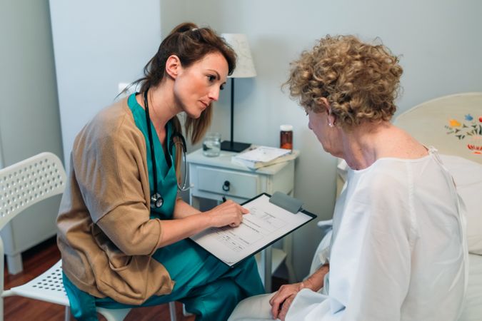 Female doctor filling out a questionnaire