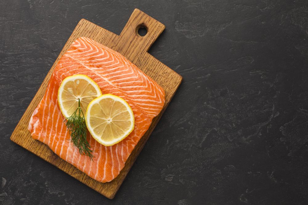 Top view of salmon and lemon slices