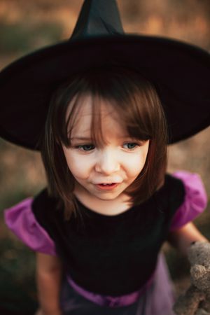 Cute girl in witch costume