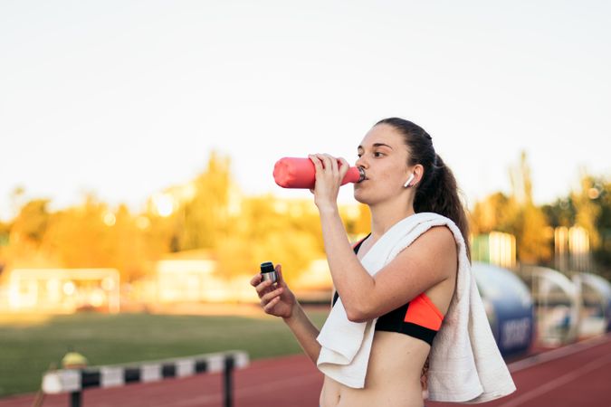 An athletic woman resting after running.