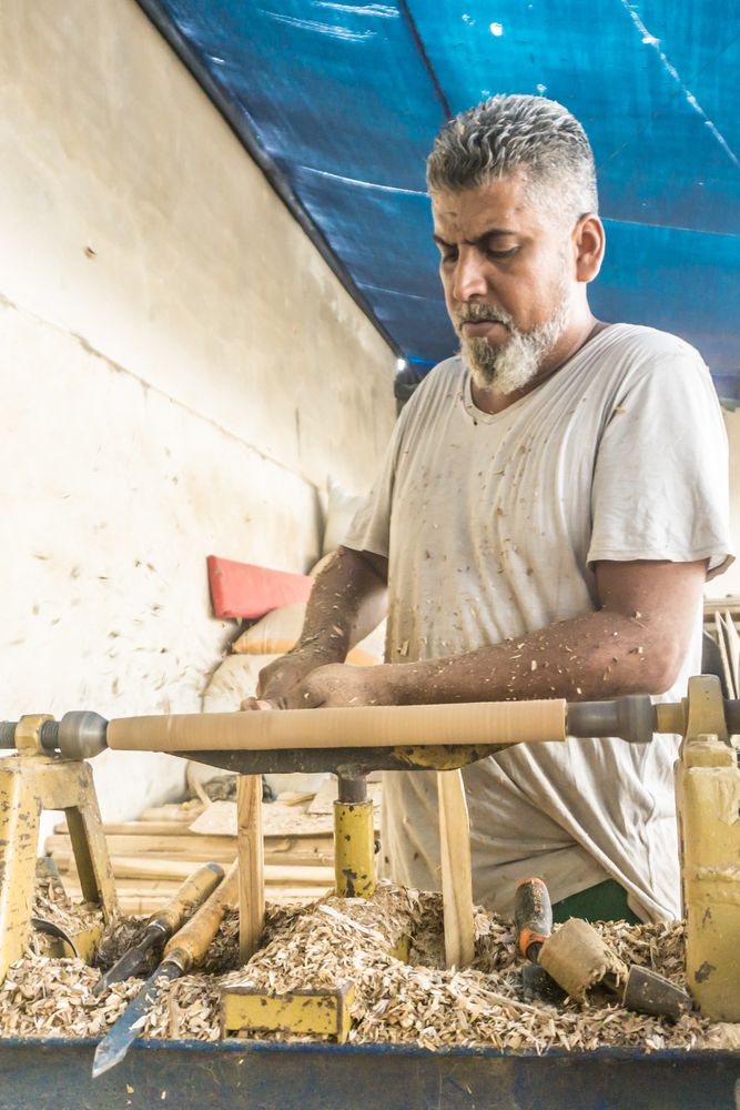 Man using woodworking machine at workplace