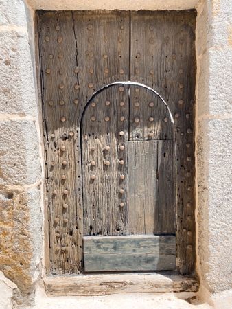 Patmian ancient wooden door with iron bolts