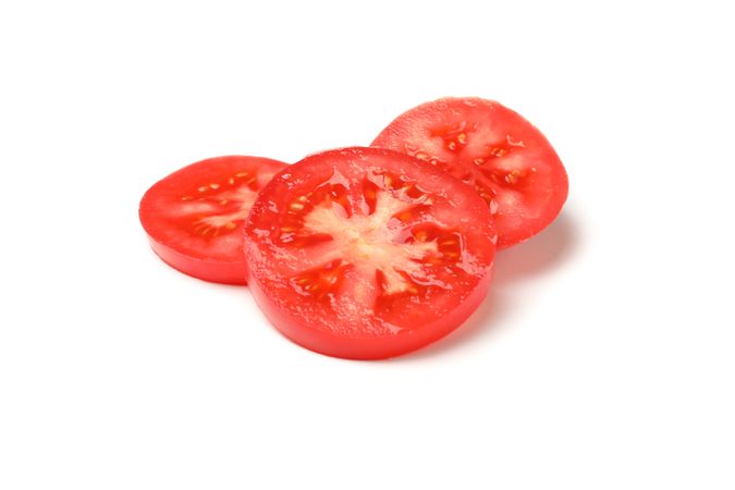 Slices of tasty tomato isolated on neutral background