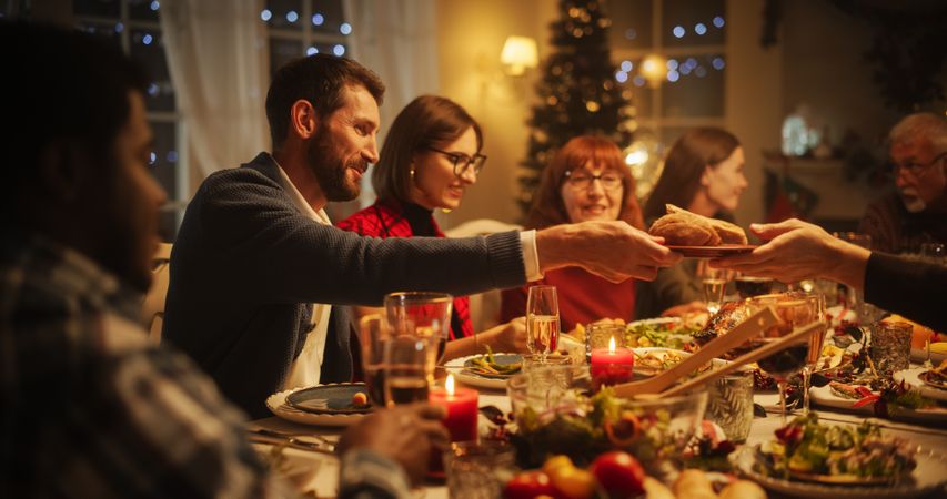 Relatives Sharing Meals, Singing Traditional Festive Songs and Setting Off Fireworks
