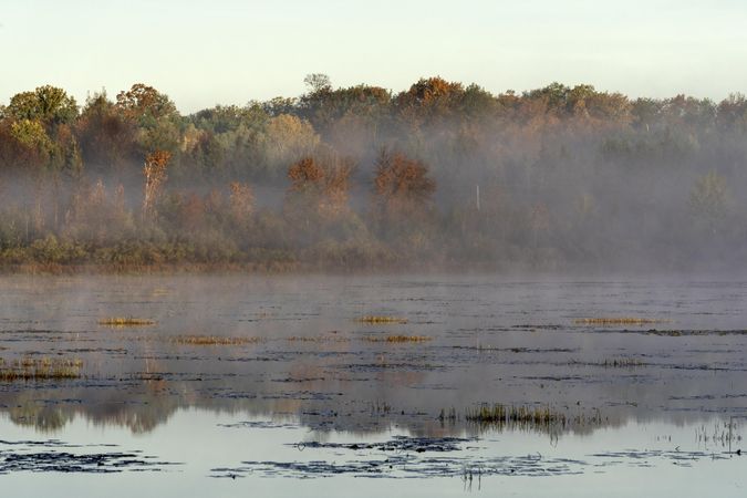 Fog and fall colors at Sandy River Lake in McGregor, Minnesota
