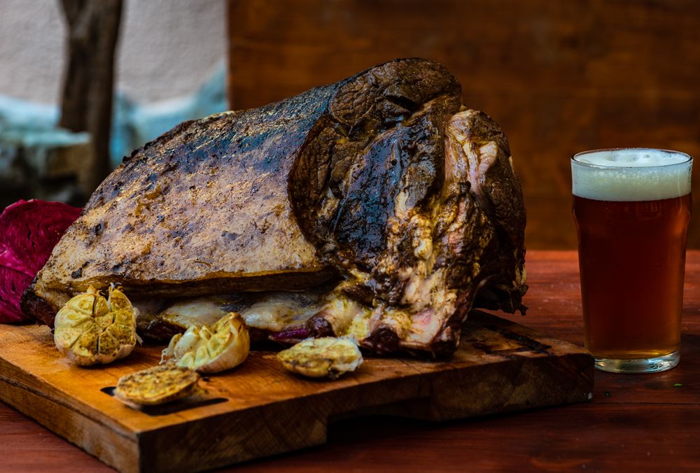 Roasted pork meat with garlic on board
