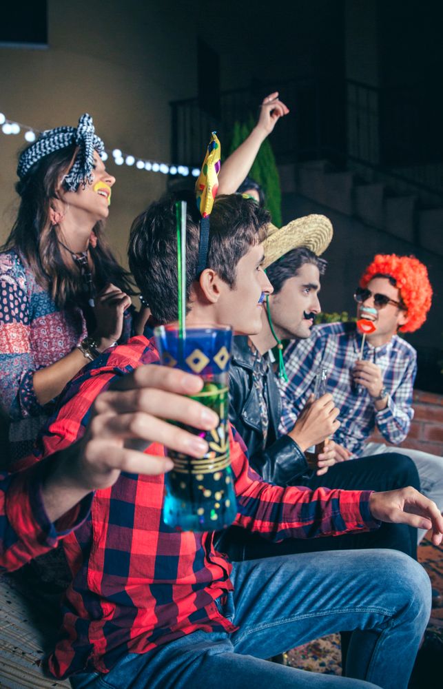Happy man with bow having fun in party