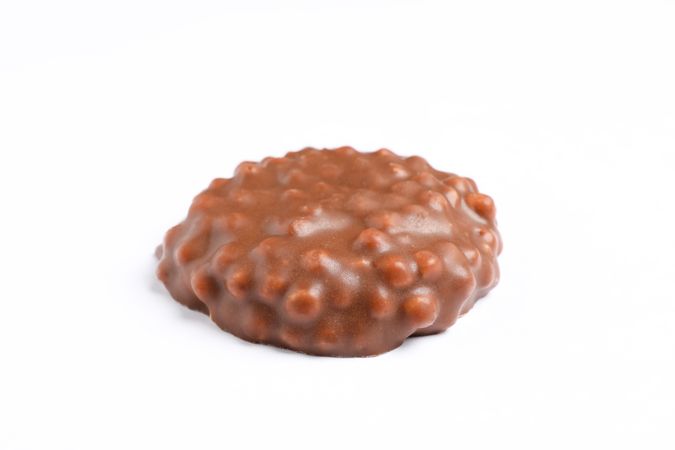 Chocolate cookie with caramel filling on plain background