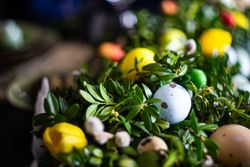 Close up of eggs nestled in lush centerpiece on table