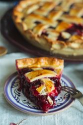 Close-up of delicious cherry pie slice with lattice topping
