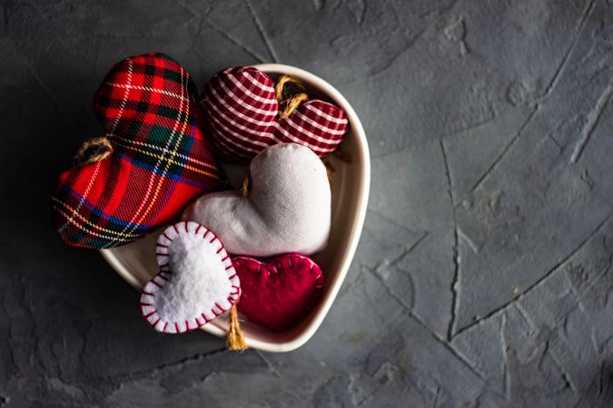 St. Valentine day flat lay with bowl of felt hearts