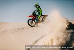 Dirt biker speeding over sand dunes 4N1wg5