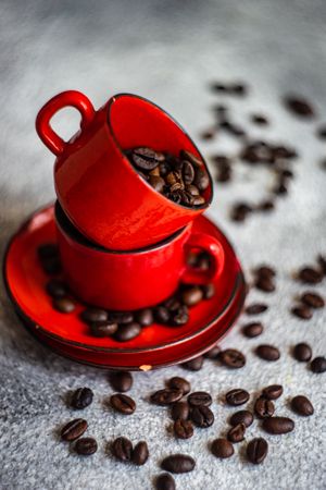 Full red cups of coffee beans