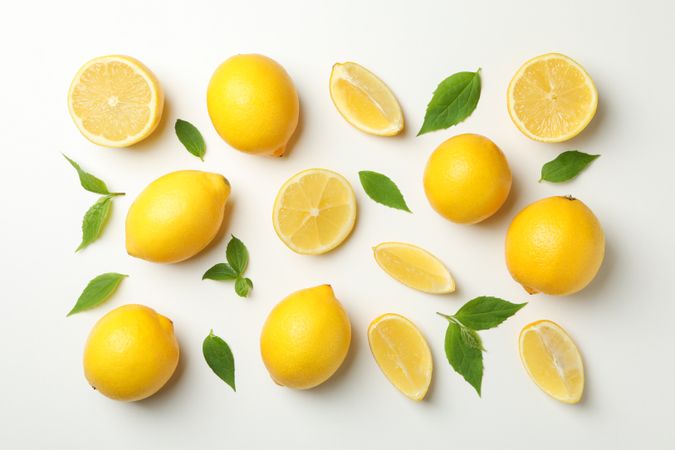 Flat lay with lemons on light background. Fresh fruit