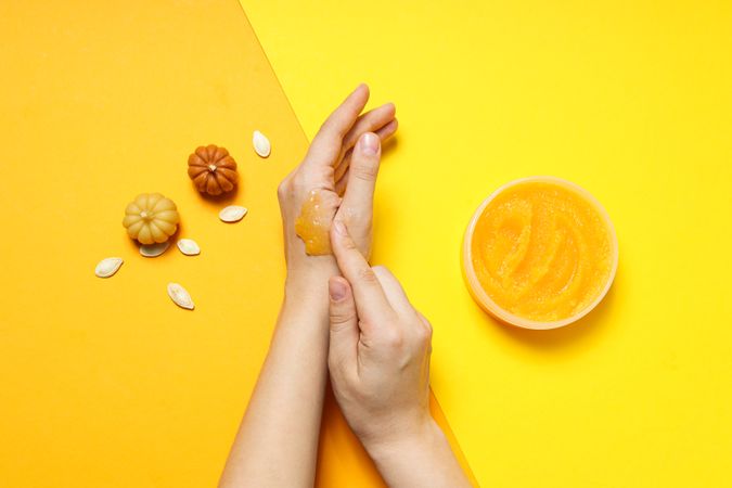 Skin care and face care concept - pumpkin cosmetic