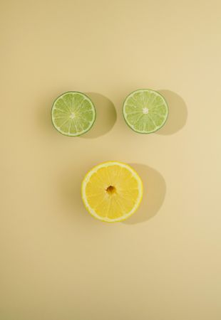 Top view of two lime slices and one lemon