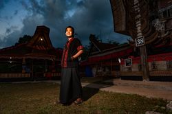 Young man standing outdoor in Tana Toraja in Sulawesi island, Indonesia