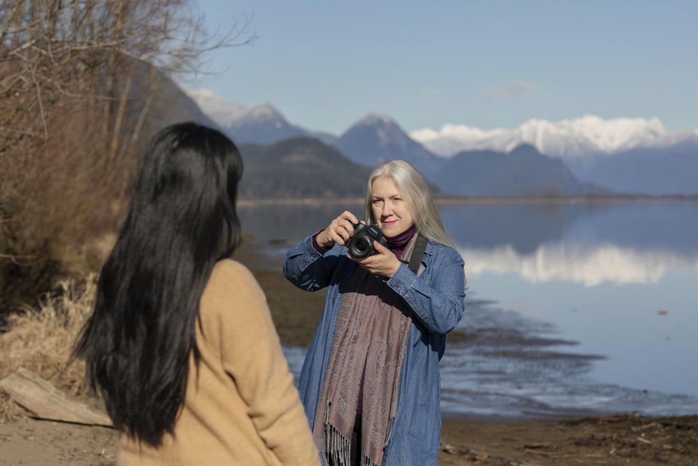 Woman photographing another female