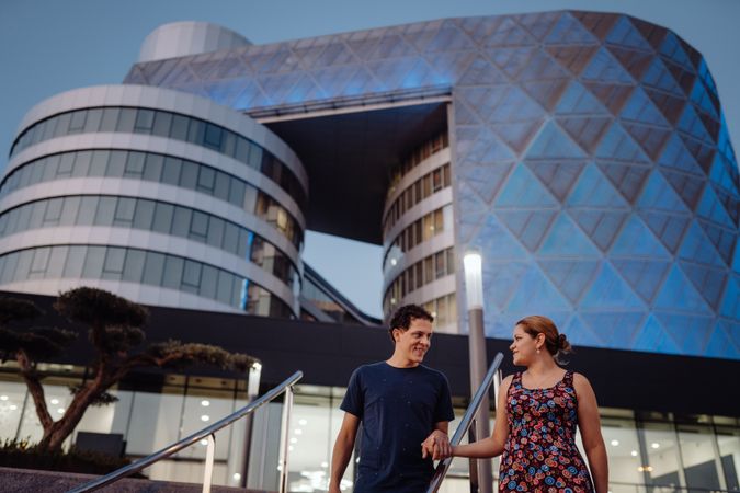Romantic couple in sunlight in city street