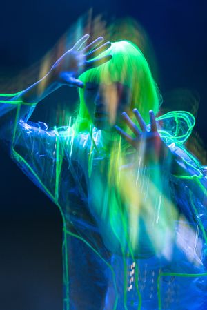 Asian woman posing in fluorescent light