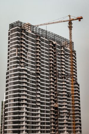 Crane over concrete building