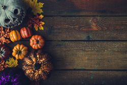 Creative autumn Halloween layout with various leaves and pumpkins