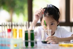 A girl doing a science experiment.