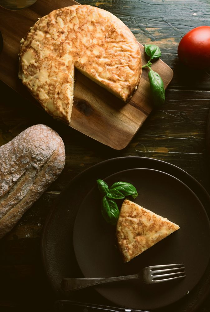 Cooking ingredients around pie on table