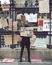 London, England, United Kingdom - June 6th, 2020: Woman standing among BLM signs 4BaoB5