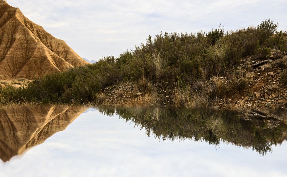 Water near stone desert hills