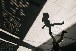 Shadow of someone running in urban setting