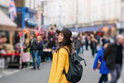 Unrecognizable tourist walking on street during festival