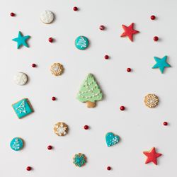 Christmas cookies and red berries with tree cookie