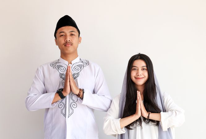 Muslim Couple Doing Greeting Gesture
