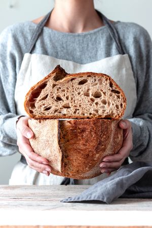 Hands of woman holding bread